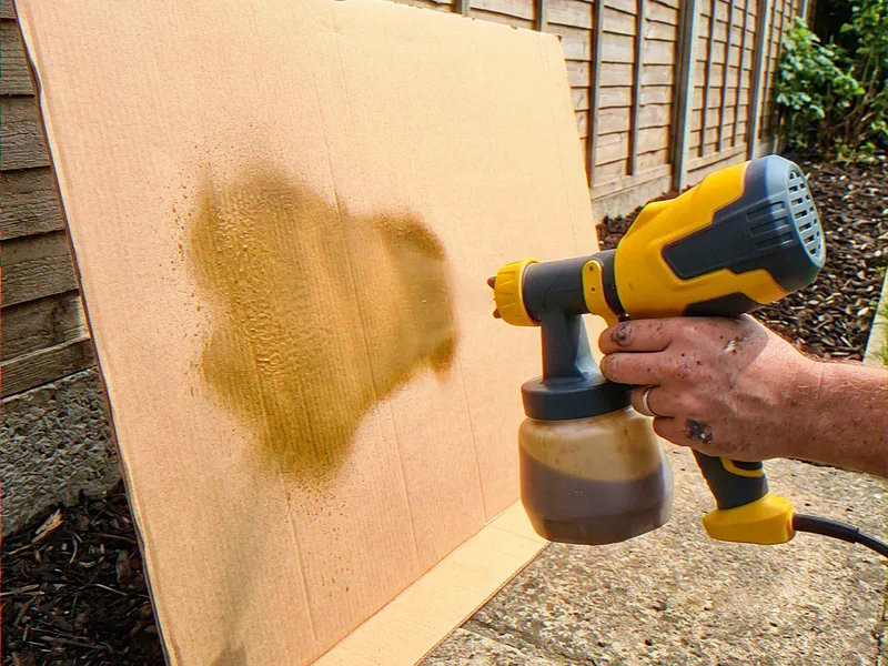 Testing the sprayer fan pattern on cardboard